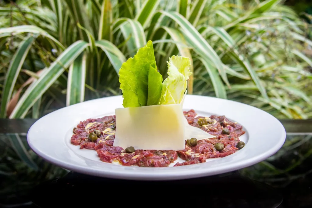 Beef carpaccio with capers and greens at Bistro Estrada in Granada, Nicaragua