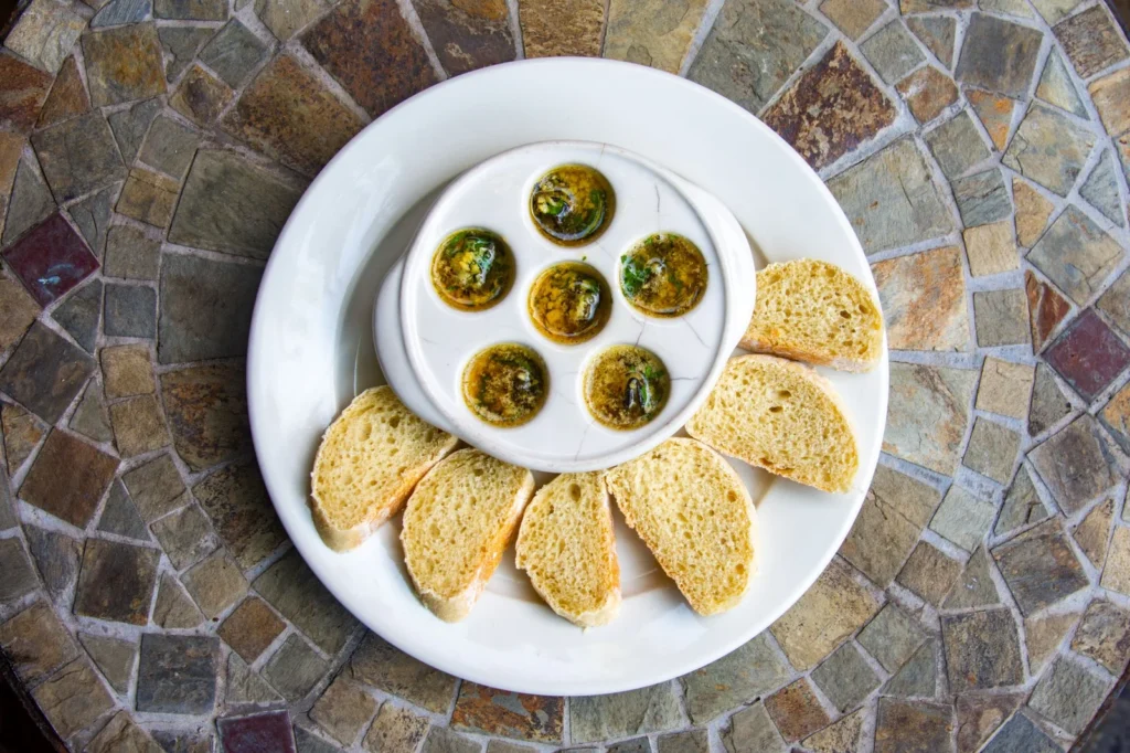 Escargot served with toasted bread at Bistro Estrada in Granada, Nicaragua