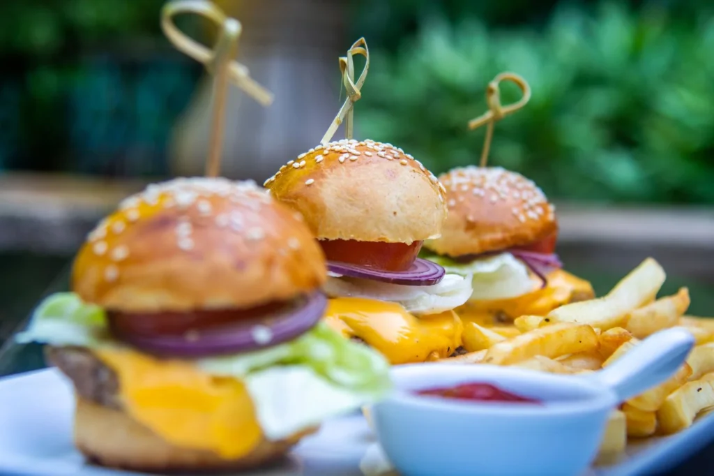 Trio of mini burgers with fries served at Bistro Estrada in Granada, Nicaragua
