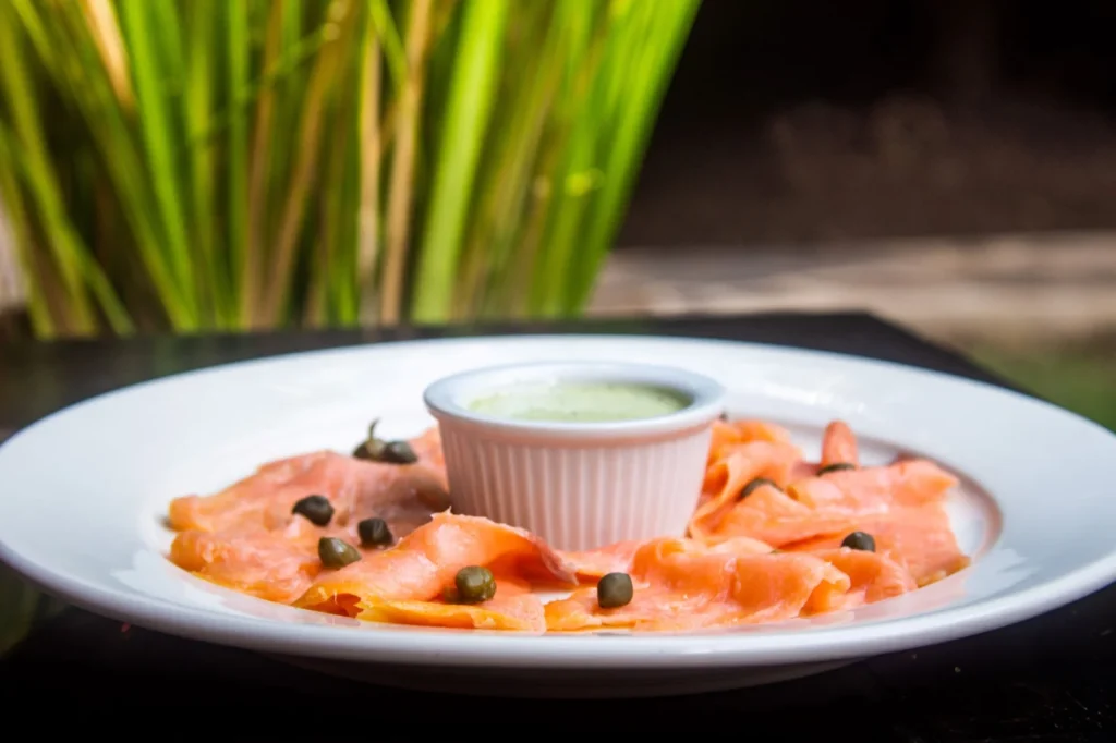 Salmon carpaccio with capers served at Bistro Estrada in Granada, Nicaragua